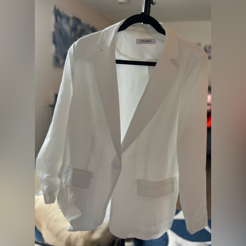 White one button blazer.with shoulder pads.